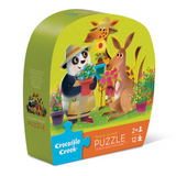 Jigsaw puzzle box with cartoon animals and 'Crocodile Creek' branding on a white background