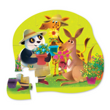 Children's puzzle with cartoon animals in a garden setting on a green background