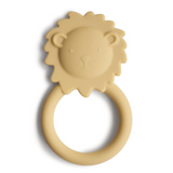 Yellow lion-shaped teething ring on a white background