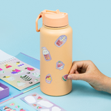 Putting stickers on a drink bottle
