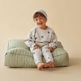 Child sitting on cushion wearing WILSON & FRENCHY Little Sparrow Organic Terry Sweat & matching sweatpants