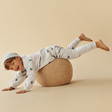 Child lying face down on ball wearing WILSON & FRENCHY Little Sparrow Organic Terry Sweat Pant & Top