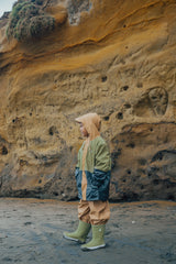 Long angle view of child wearing CRYWOLF Explorer Jacket - Fern Colourblock and Fern Rain Boots