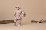 Studio shot of girl wearing hood up on CRYWOLF Splash Suit - Daisy Floral and mauve rain boots