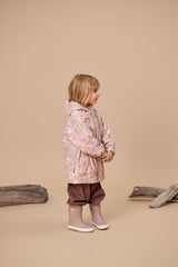 Side view of child wearing CRYWOLF Explorer Jacket - Daisy Floral and Mauve Rain Boots