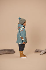 Side view of chid wearing the CRYWOLF Explorer Jacket - Move Mountains - blue jacket with brown & white mountain print