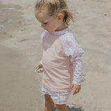 Child wearing CRYWOLF Baby Rash Vest - Ditsy Floral - side view