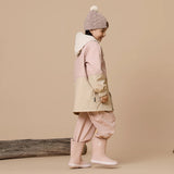 Side view of girl wearing CRYWOLF Explorer Jacket - Pink, Pink Rain Overalls and Pink Gumboots