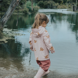 Side view of child wearing CRYWOLF Play Jacket Tui, Rosewood Rain Overalls and Dusty Pink Rain Boots
