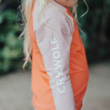 Side view of Crywolf logo on sleeve on the CRYWOLF Rash Vest - Sunset Colour Block