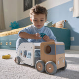 Child playing with the JANOD Car Carrier with Vehicles