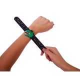 Child putting on the IS GIFT Dinosaur Slap Bands black