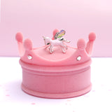 Unicorn ring sitting on top of crown box