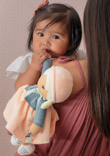 Baby holding KALOO Tendresse Chloe