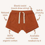 Brown shorts with text highlighting features on a white background