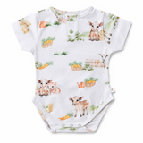Baby onesie with farm animal pattern on a white background