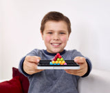 Boy holding the SMART GAMES IQ Puzzler PRO in 3D format