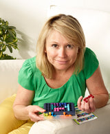 Lady playing with SMART GAMES IQ FIT