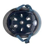 Close-up of underside of a helmet with a blue strap on a white background