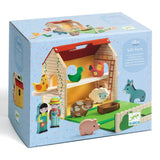 Box packaging of a children's farm toy set with farm animals and figures on a blue background.