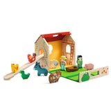 Wooden toy farm set with animals and barn on a white background
