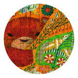 Round jigsaw puzzle with a colorful design of a face and nature elements on a white background.