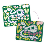 Two decorative cards with a snake and floral design on a green background.