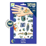 Packaged tattoo set with glow-in-the-dark designs on a blue background