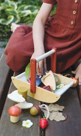 Detail shot of girl playing outside with the DJECO Wild Wood Foraging Trug (Basket)