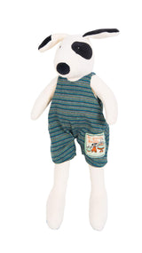 Black & white plush toy dog wearing green & blue striped overalls on a white background
