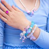 Girl wearing Lauren Hinkley bracelets - mermaid theme