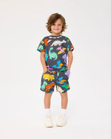Studio shot of boy wearing ROCK YOUR BABY ON THE MOVE TRACK SHORTS and matching tee