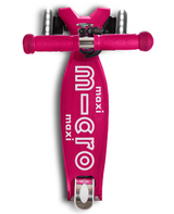 Pink scooter with 'maxi MICRO' branding on a white background