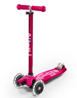 Pink scooter with visible branding on a white background