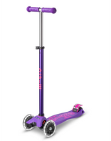 Purple scooter with pink accents on a white background