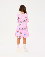 Back view of girl wearing ROCK YOUR BABY SOMEWHERE OVER THE RAINBOW LONG SLEEVE WAISTED DRESS