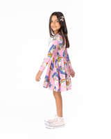 Side view of girl wearing ROCK YOUR BABY UNICORN DAISY LONG SLEEVE WAISTED DRESS