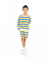 Studio shot of boy wearing the ROCK YOUR BABY VINTAGE STRIPE SWEATSHIRT and matching shorts