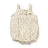 Baby romper with lemon leaf pattern and ruffle neckline on a white background