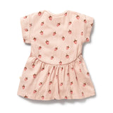 Back of Pink baby dress with strawberry pattern on a white background