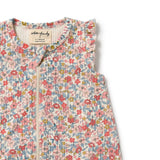 Floral patterned baby outfit with a visible brand label on a white background