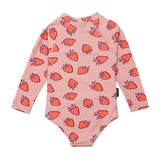 Pink children's onesie with strawberry pattern on a white background