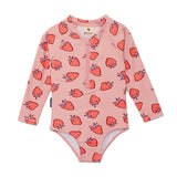 Pink children's swimsuit with strawberry pattern on a white background
