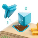 Blue triangle block from the DJECO Multi Boita Shape Sorter