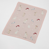 Pink blanket with animal pattern on a white background