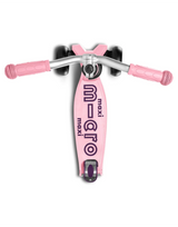 Pink scooter with 'Maxi Micro' branding on a white background