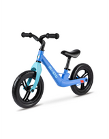 Blue balance bike with black wheels on a white background