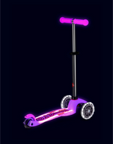 Purple scooter with LED lights on a black background