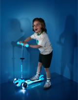Child riding a scooter with glowing wheels against a blue background