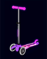 Pink scooter with purple accents on a black background